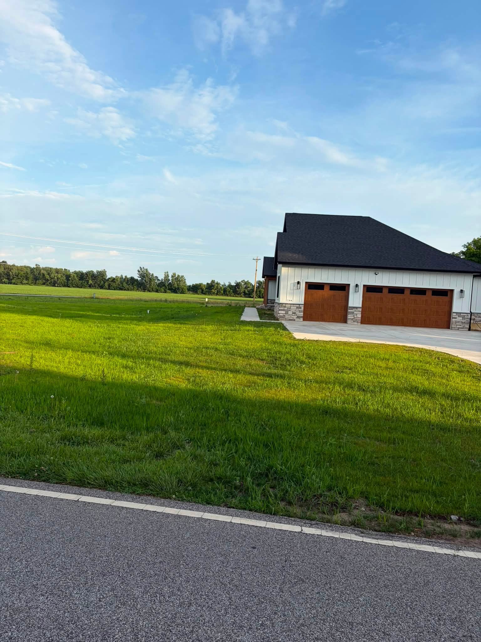 Graded and established lawn beside a residential garage